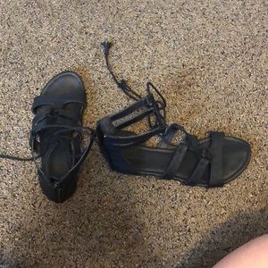 Maurice’s black gladiator sandals